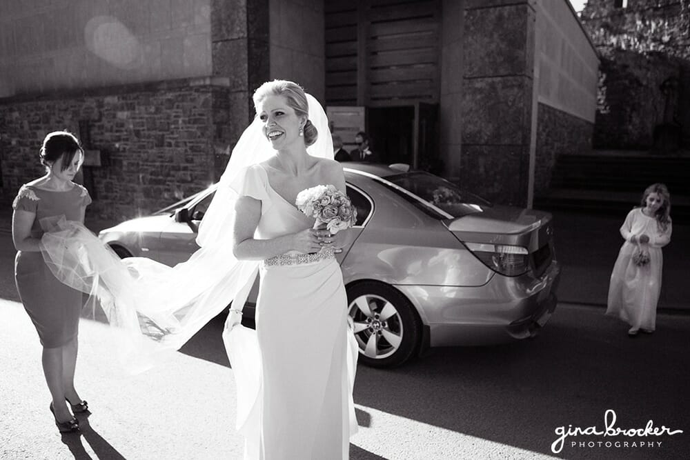 A documentary style photograph of a bride moments before she walks down the aisle at her Boston Wedding