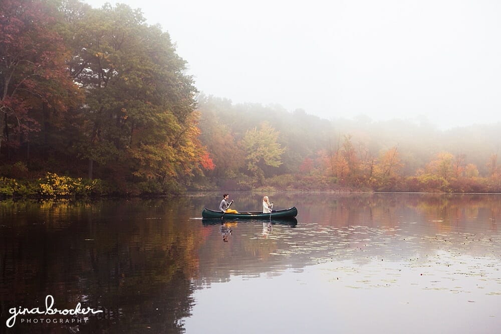 A couple take a canoe trip in the charles river during their fall engagement session.