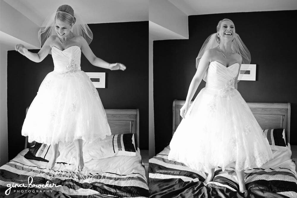 Bride in tea length wedding dress jumping on bed