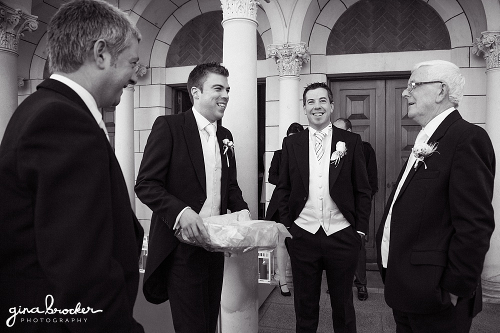 Groomsmen greet guest when the enter the church for the classic wedding ceremony
