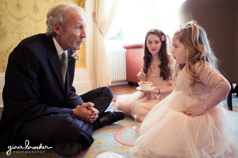Flower girl and grandfather at wedding reception