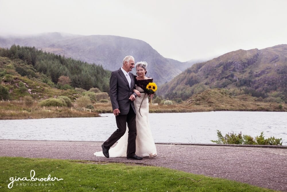 Bride and Grandfather Walking to Church with Mountain Backdrop