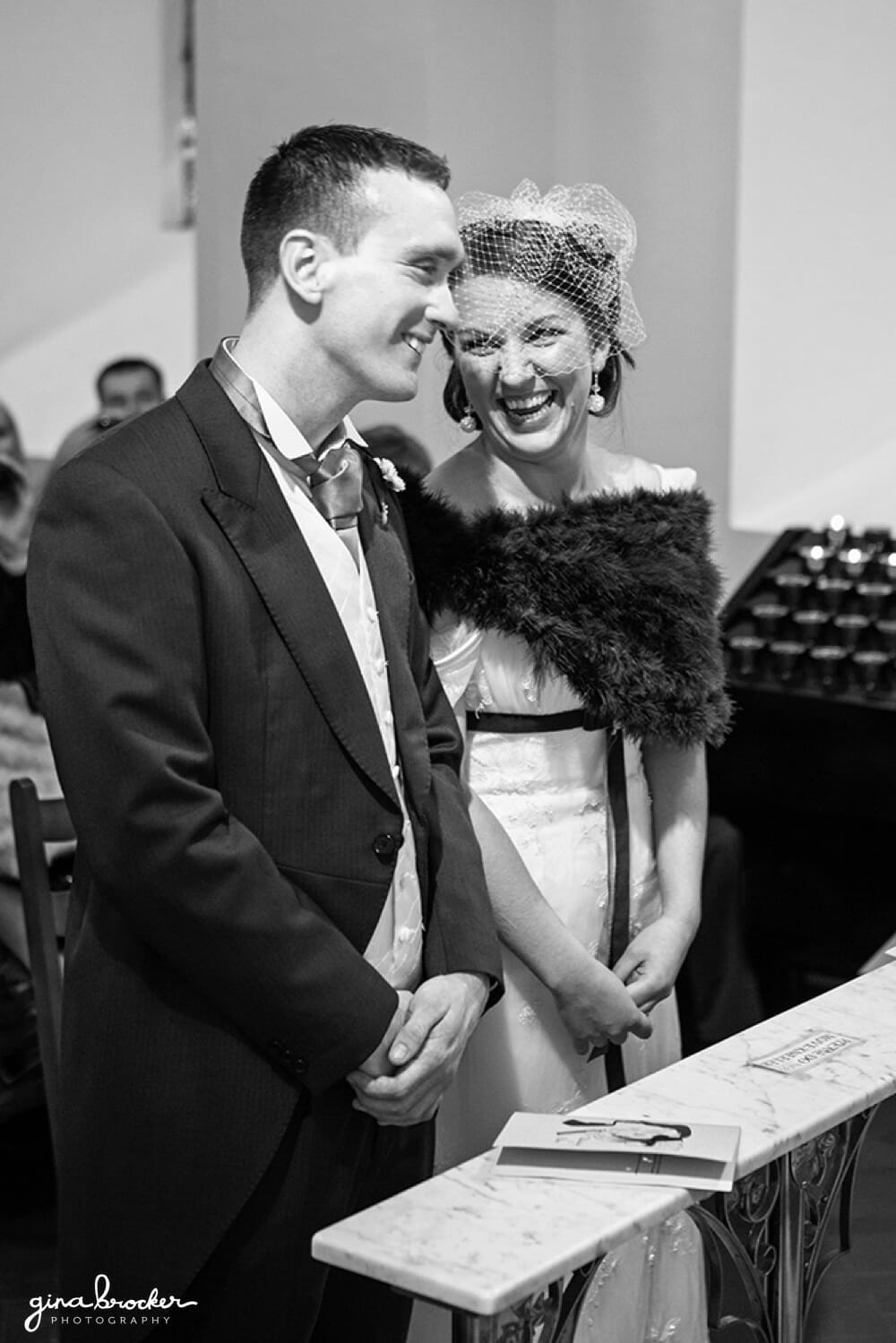 Bride and Groom Laugh Together During Wedding Ceremony