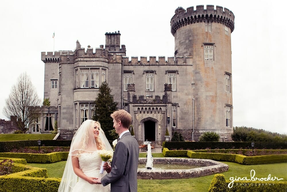 bride and groom with castle