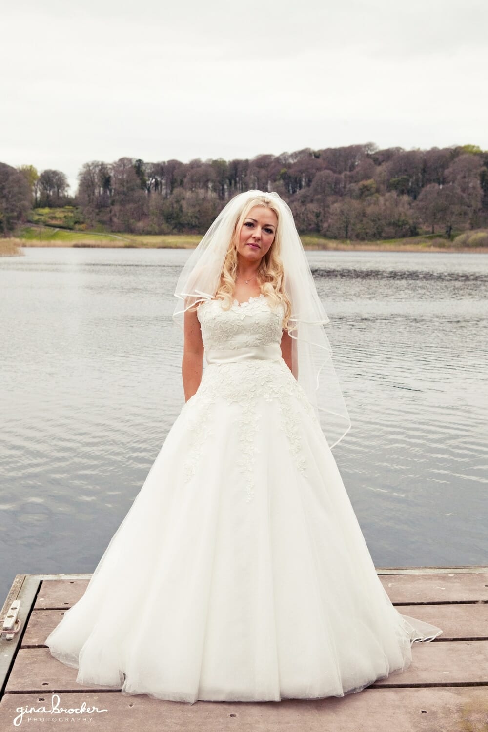 classic bride beside lake