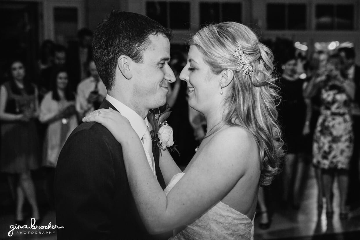 The bride and groom have an intimate moment during their first dance as a married couple
