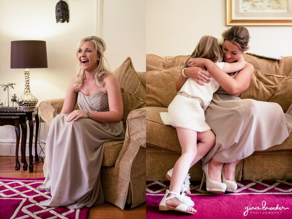 Bridesmaids laugh and hug while getting ready on the morning of elegant wedding