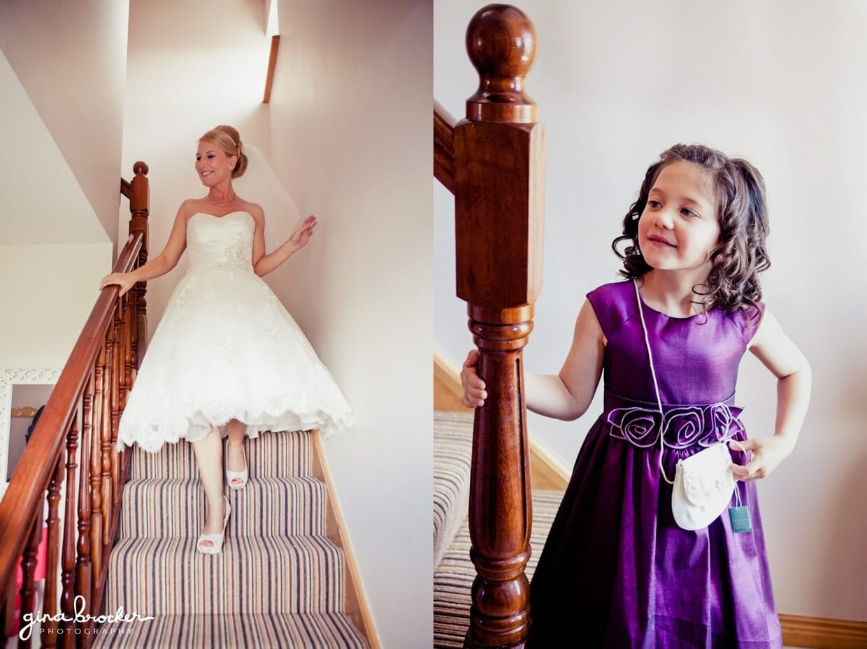A flower girl watches the bride as she walks down the stairs and leaves for her wedding ceremony