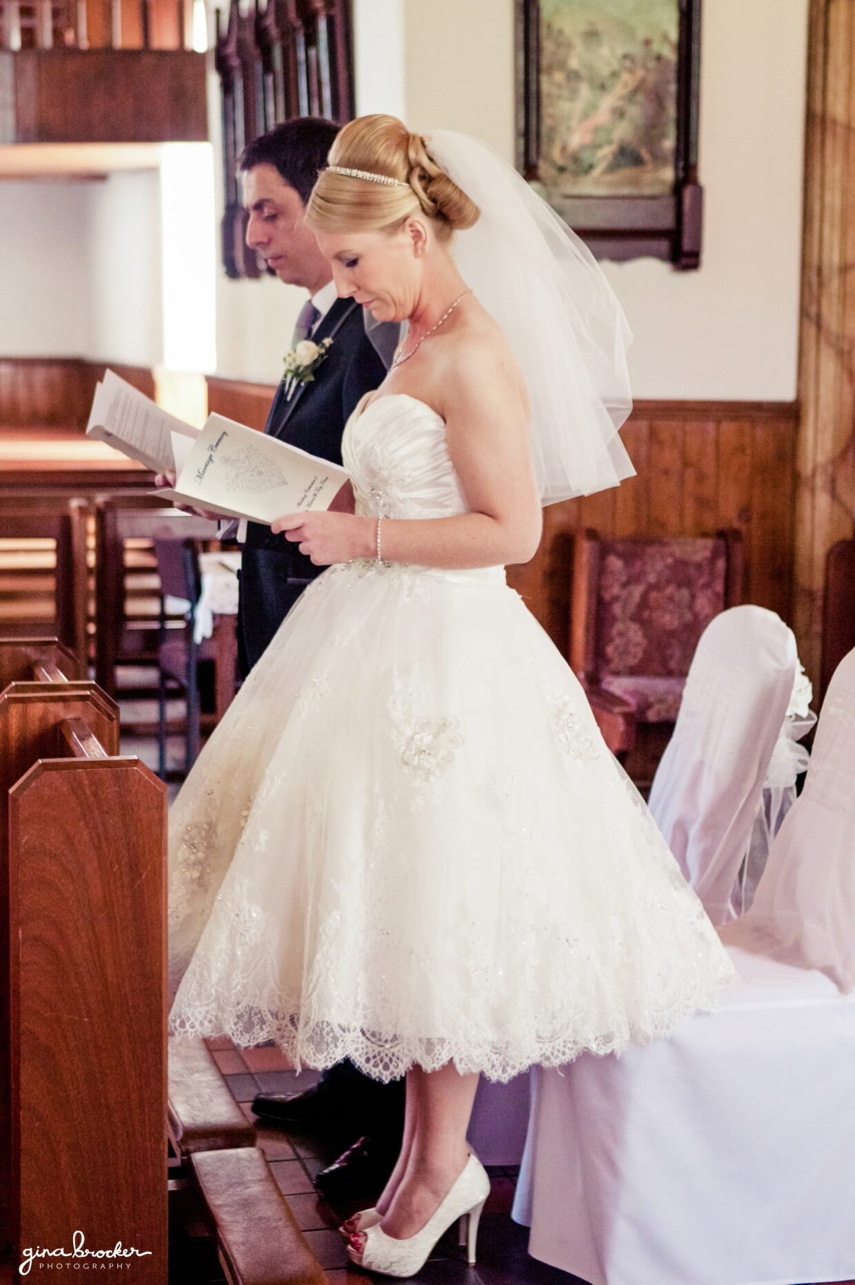 The bride and groom read a prayer together during their intimate and sweet wedding ceremony