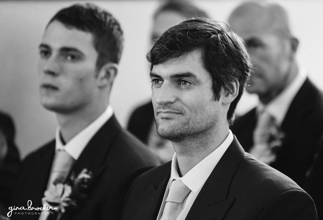 A candid portrait of the best man during his brothers intimate wedding ceremony in a small church