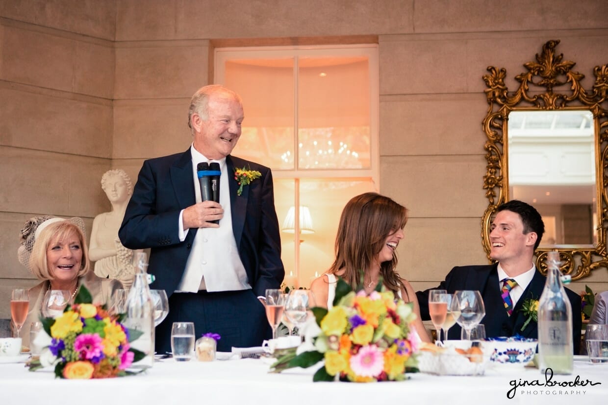 The father of the groom gives a sweet toast at his daughters colorful and elegant wedding