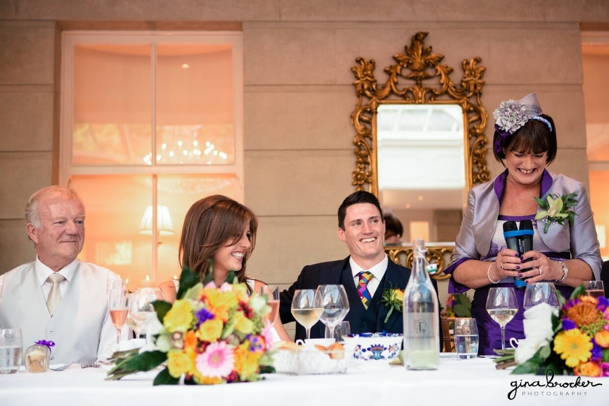 The mother of the groom gives a sweet toast during her sons colorful and elegant wedding
