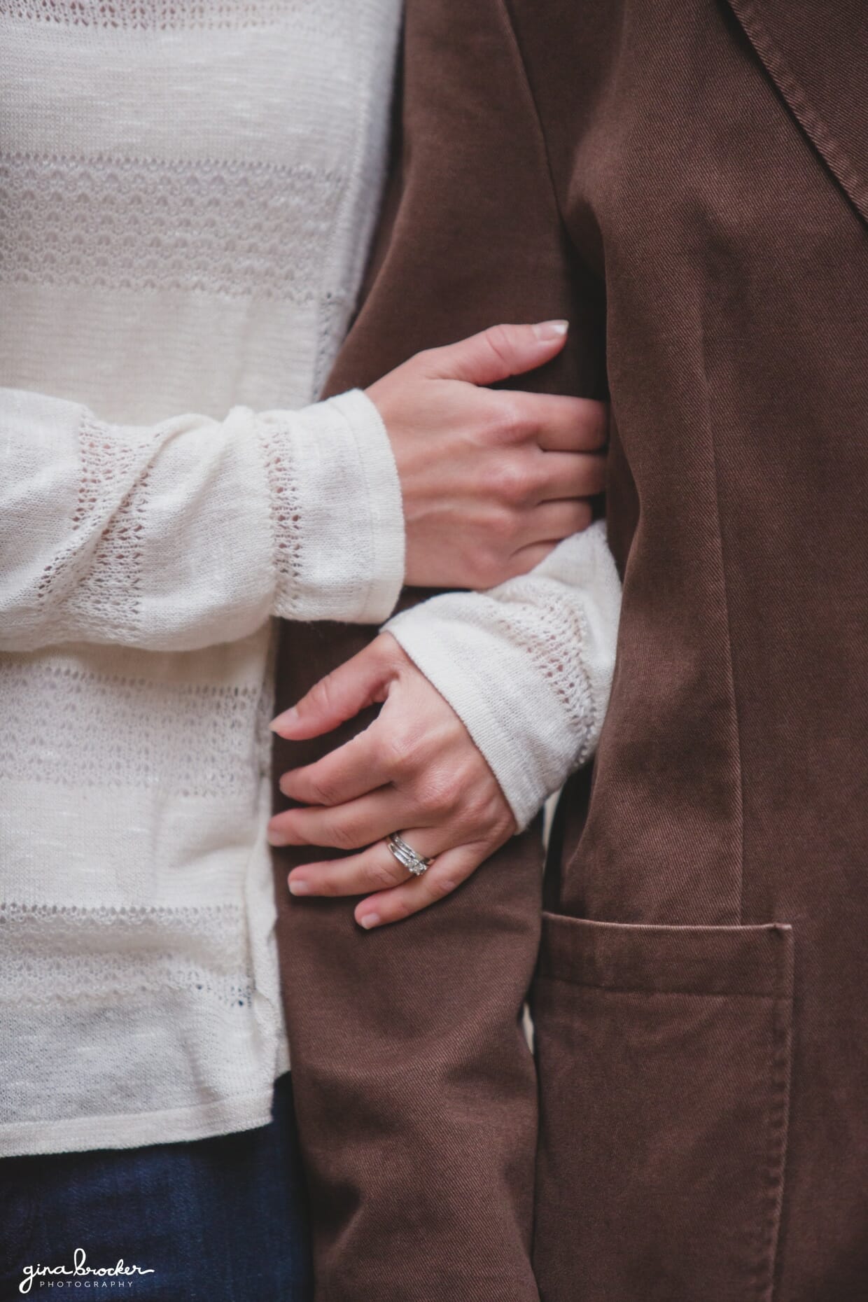 A detailed photograph of a couple with engagement ring during their couple session in Beacon Hill