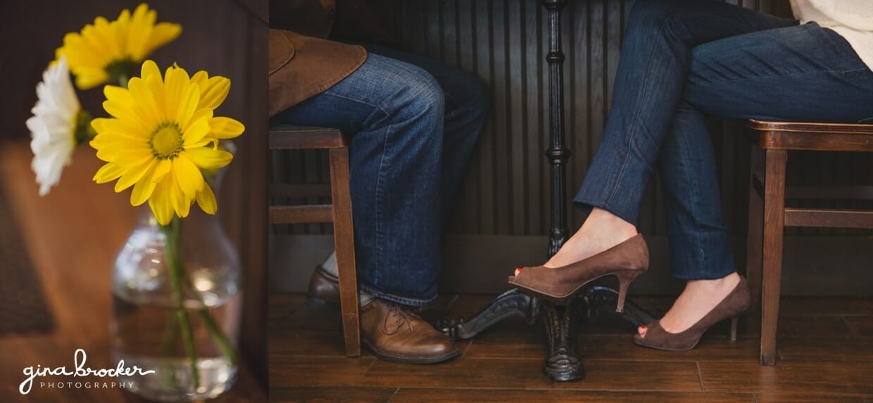 A detailed photograph of a couples legs as they sit with each other in a beacon hill cafe during their couple session