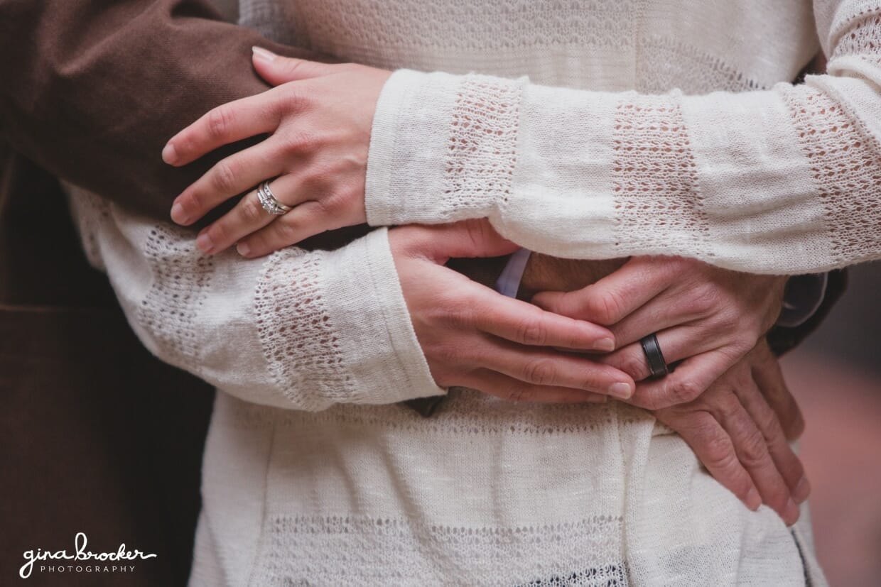 A detailed photograph of a couple hugging during their Beacon Hill engagement session