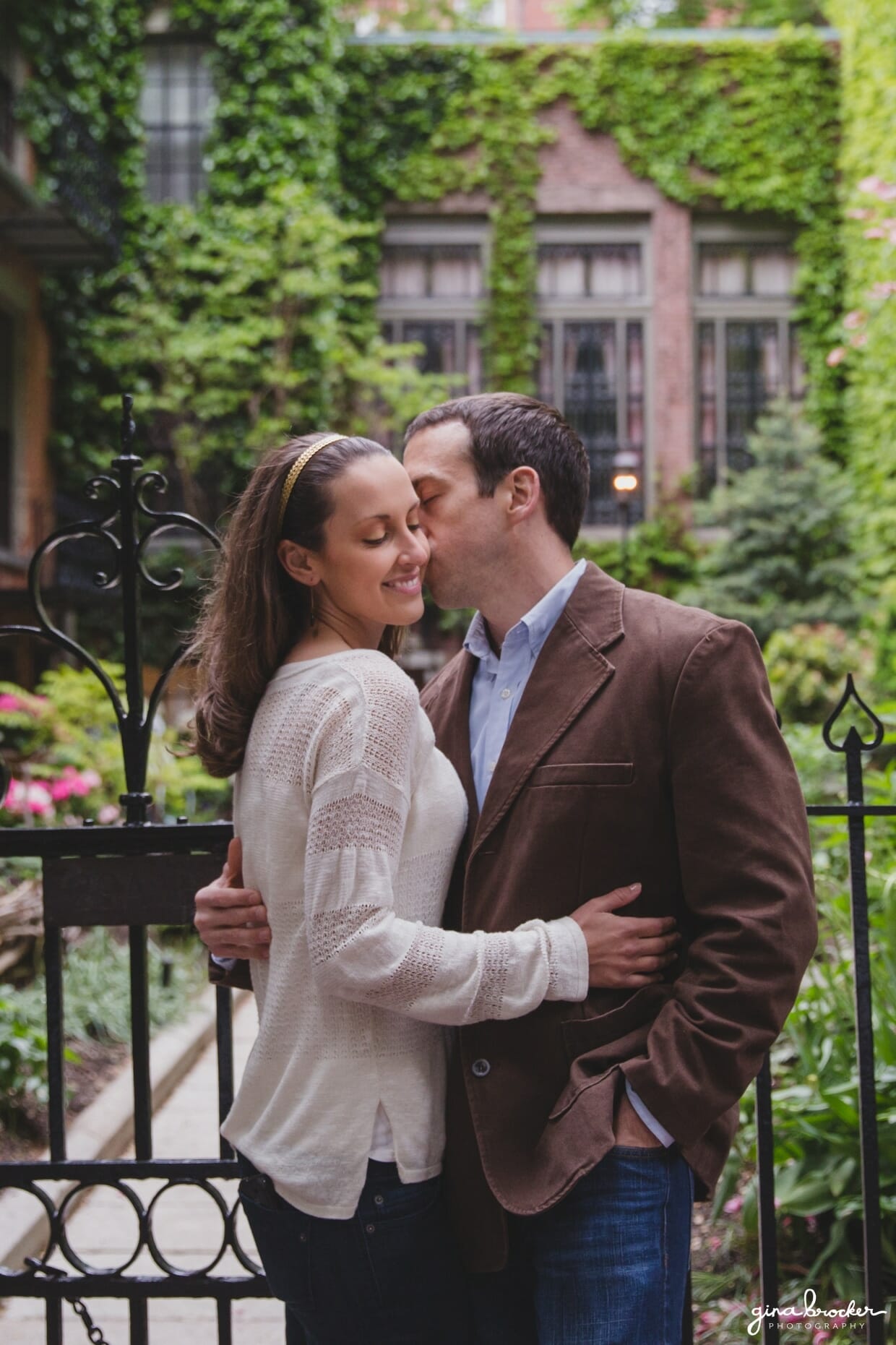 A couple kiss in the beautiful beacon hill during their sweet boston engagement session