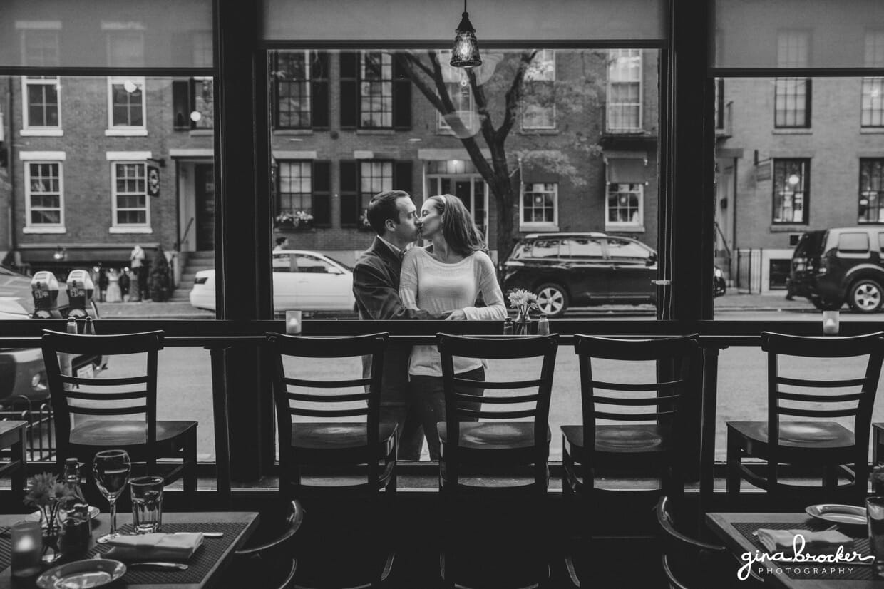A couple share a romantic kiss outside Panicificio cafe in Boston's Beacon Hill