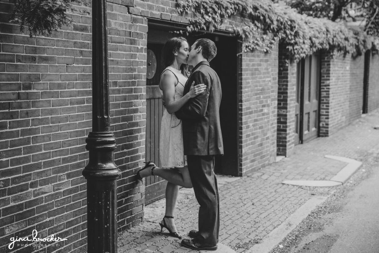 A couple share an intimate kiss during their boston engagement session
