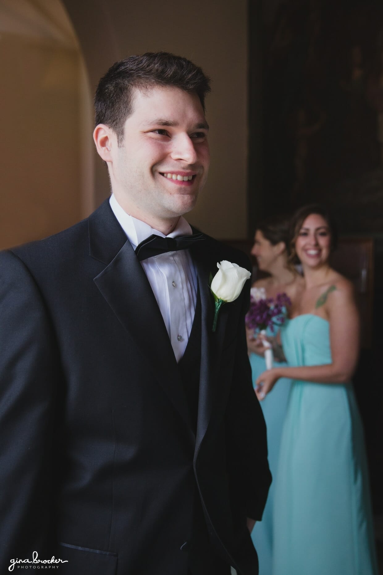 A candid portrait of a groom just before his wedding ceremony at the Sacred Heart of Jesus Church in Cambridge, Massachusetts