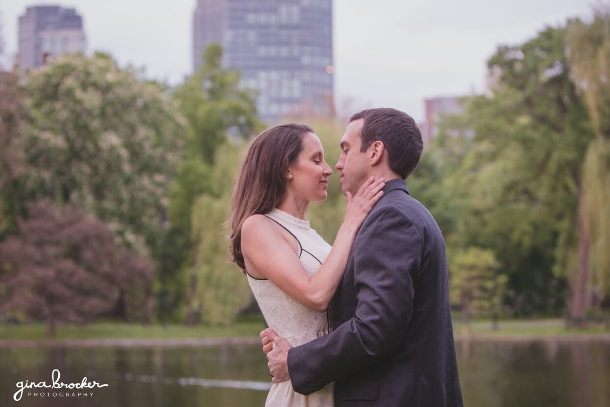 A sweet moment between a couple just before they kiss captured during their engagement session in the Boston Public Gardens