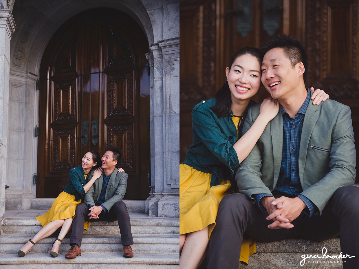 A couple sit together and laugh during their fun engagement session at the Christian Science Center in Boston, Massachusetts