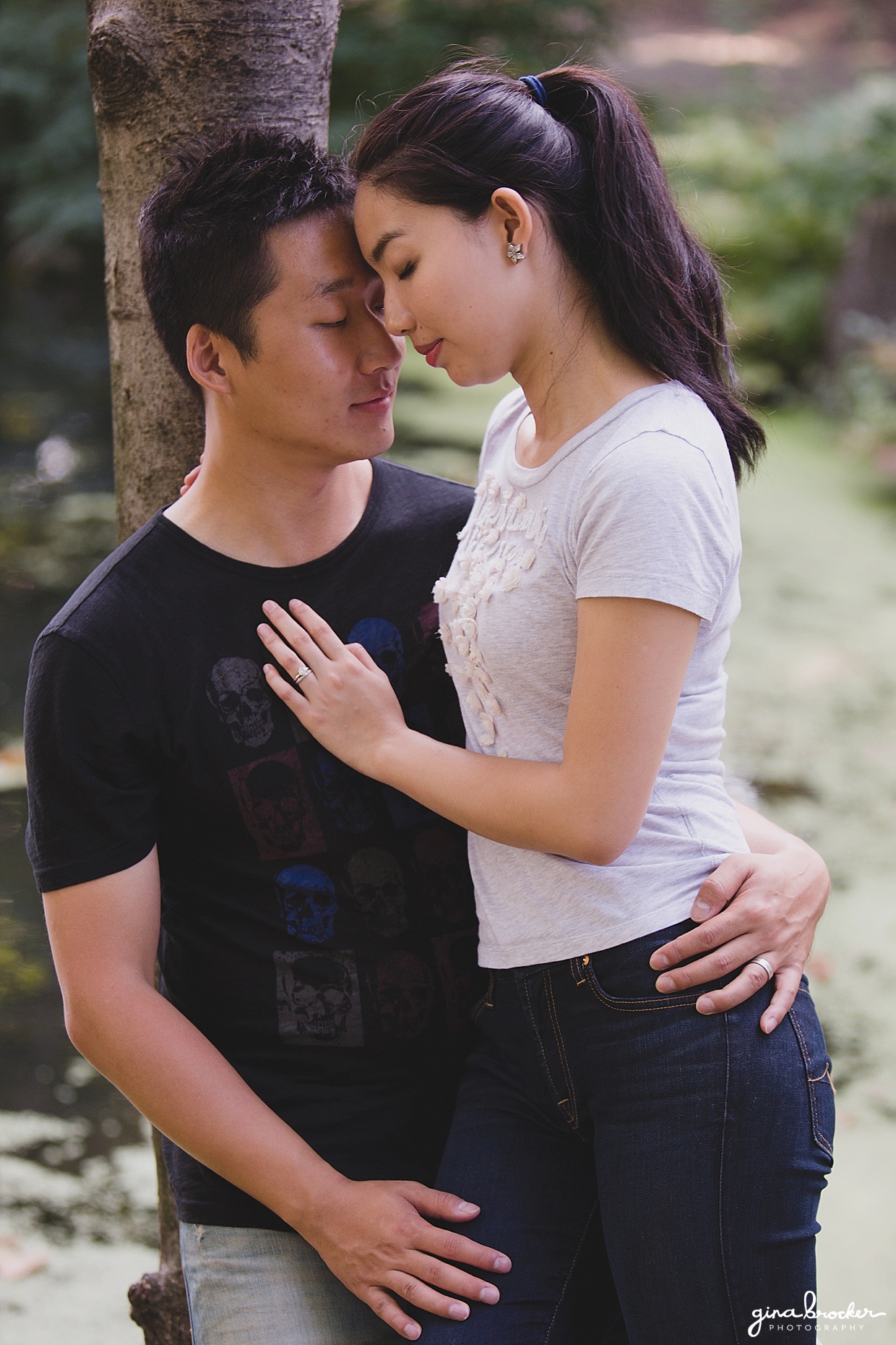A sweet and romantic photograph of a couple during their park engagement in Boston's Back Bay Fens