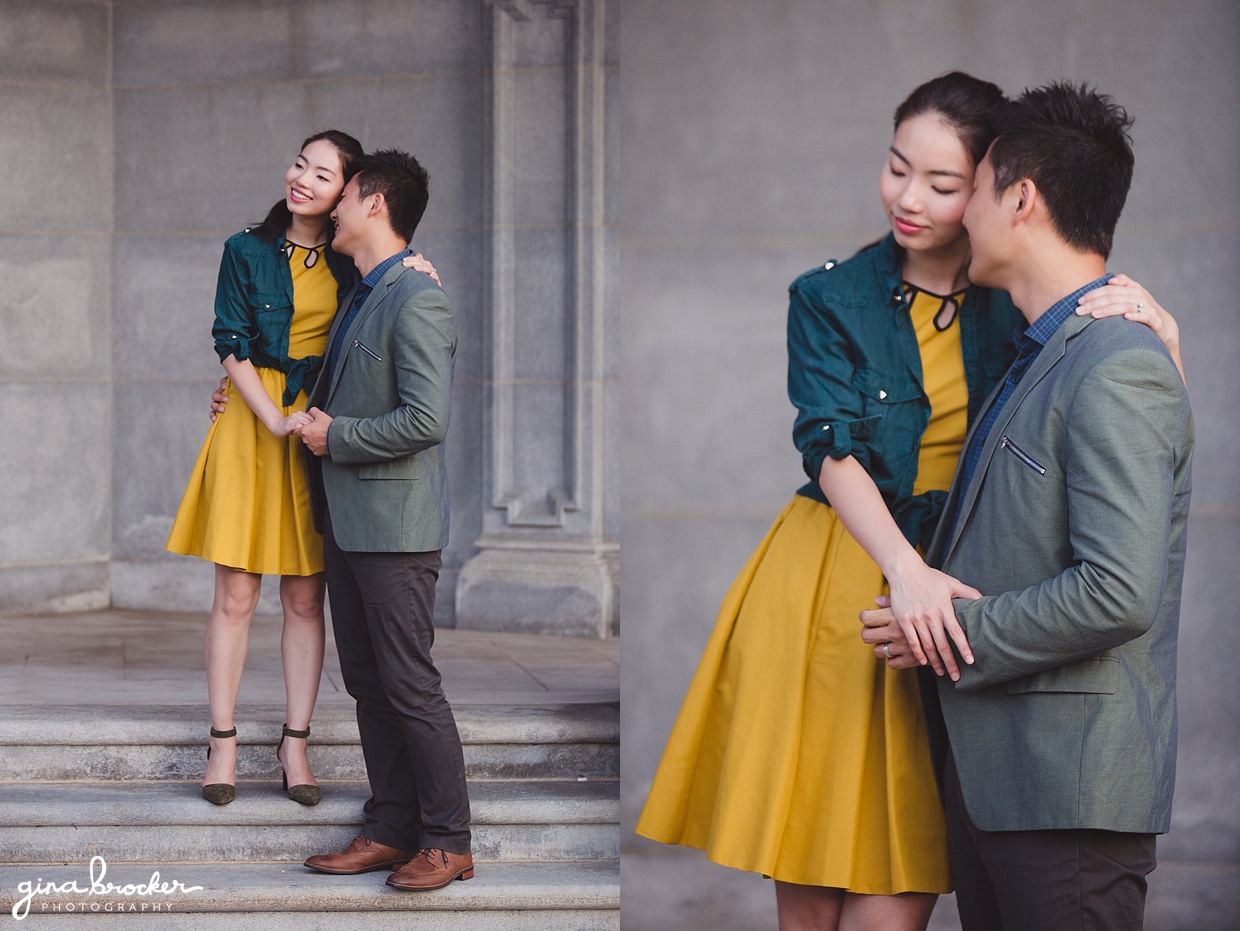 A couple cuddle each other on the steps of the Christian Science Center during their Boston Engagement Session