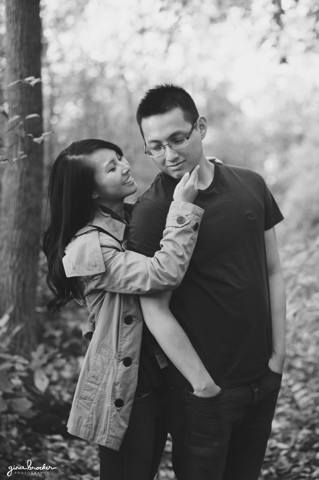 A sweet portrait of a couple in the woods during their fall engagement in boston