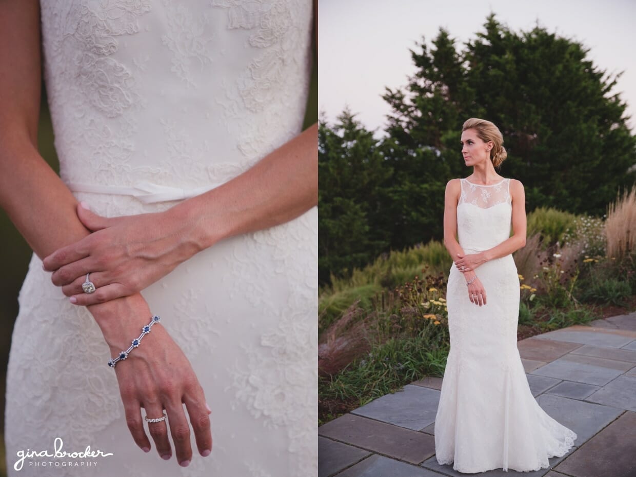 A sunset portrait of a bride wearing a beautiful lace Amy Kuschel dress, a blue sapphire bracelet and an antique wedding ring during her Westmoor Club wedding in Nantucket, Massachusetts