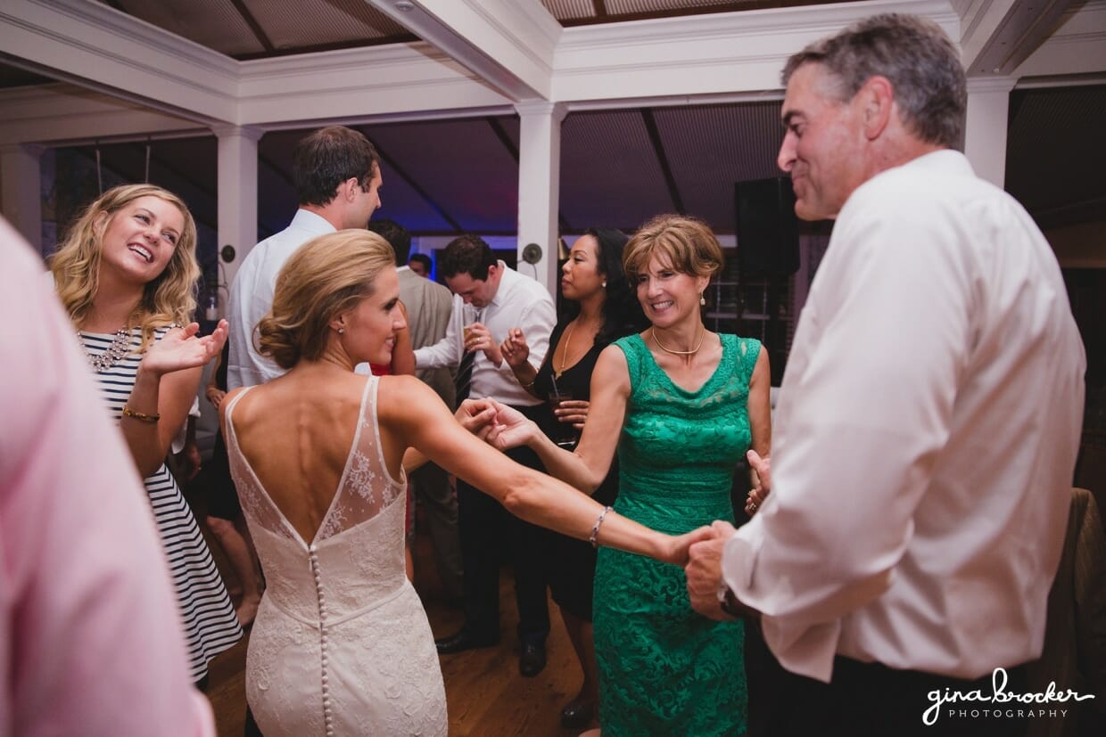 A fun photograph of bride dancing with her parents at the Westmoor Club during their Nantucket Wedding reception