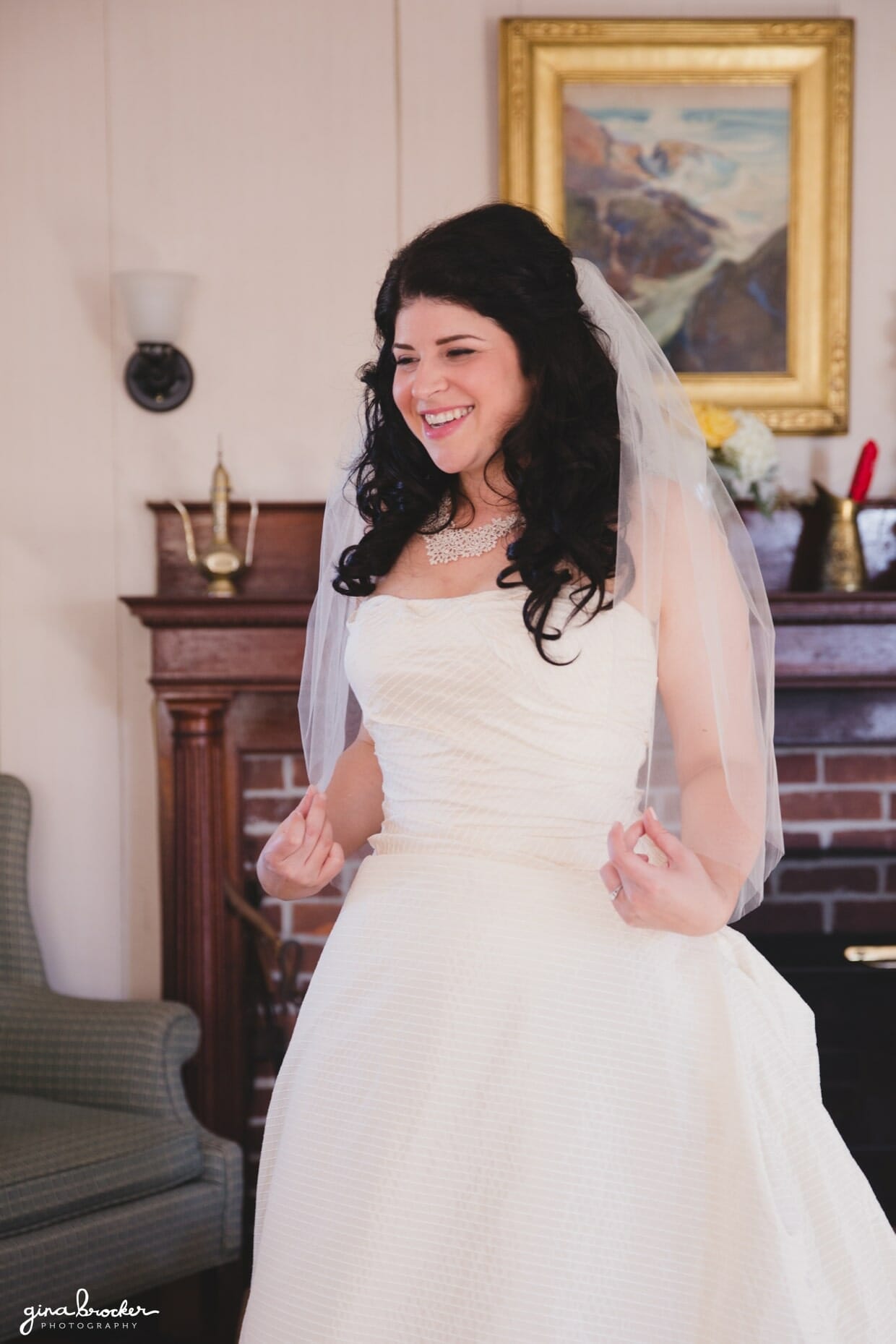 A bride smiles after she gets ready on the morning of her oxford farm wedding in Massachusetts
