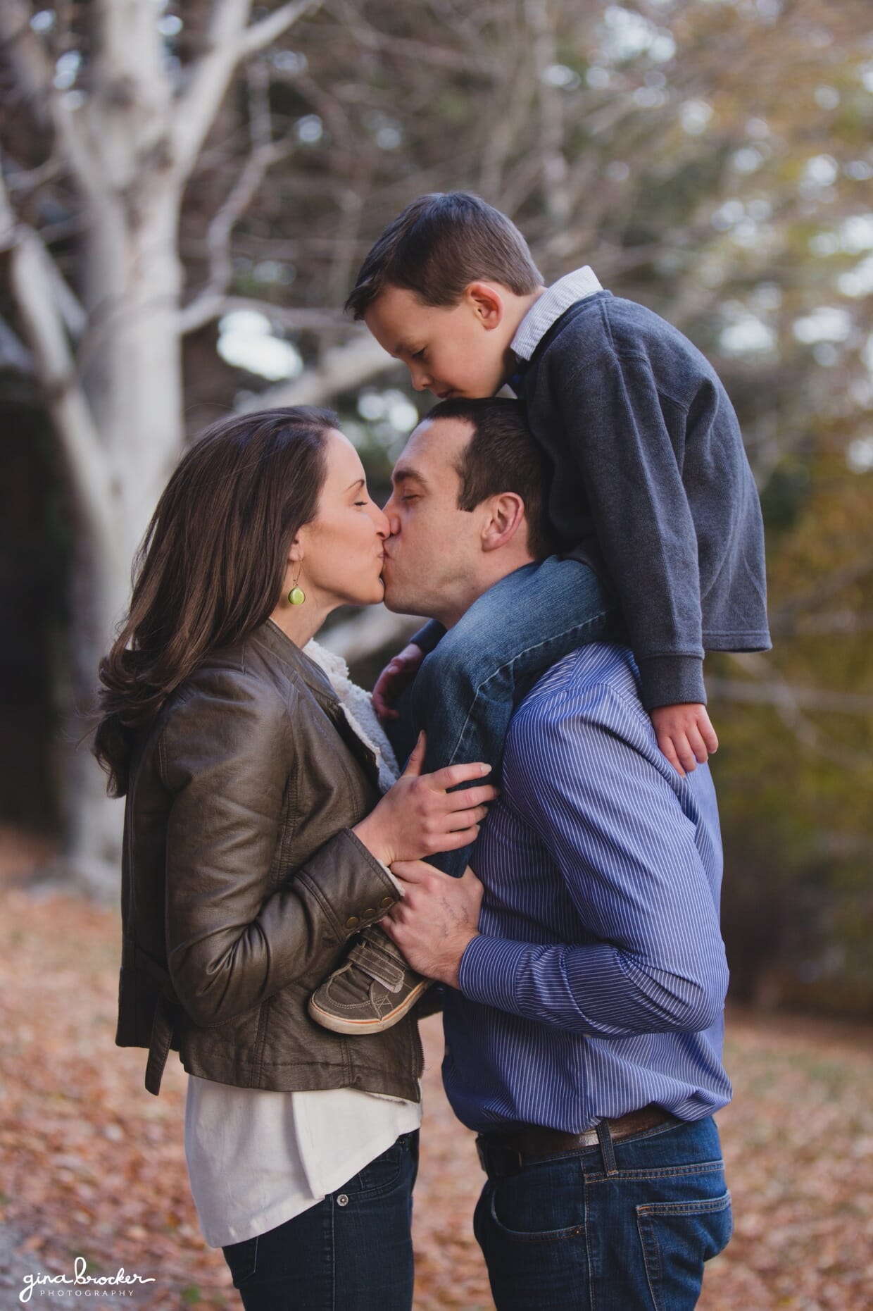 A cute portrait of a family during their natural family photo session in Boston's Arnold Arboretum
