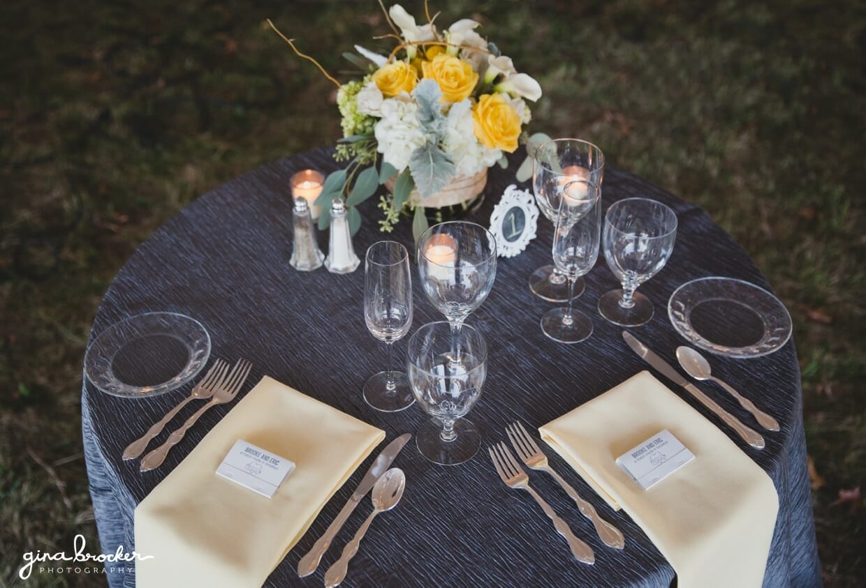 A detailed photograph of the sweet heart table with yellow and grey accents at an Oxford farm wedding in Massachusetts