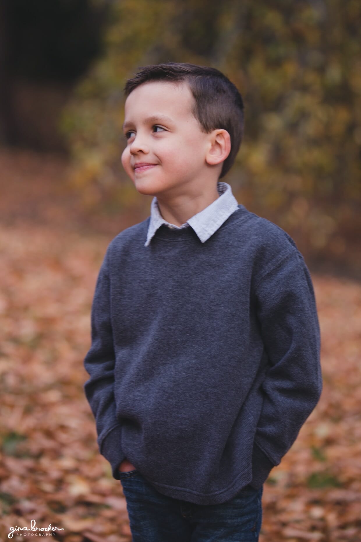 A cute and natural portrait of boy in the park during their fall family photo session in Boston's Arnold Arboretum