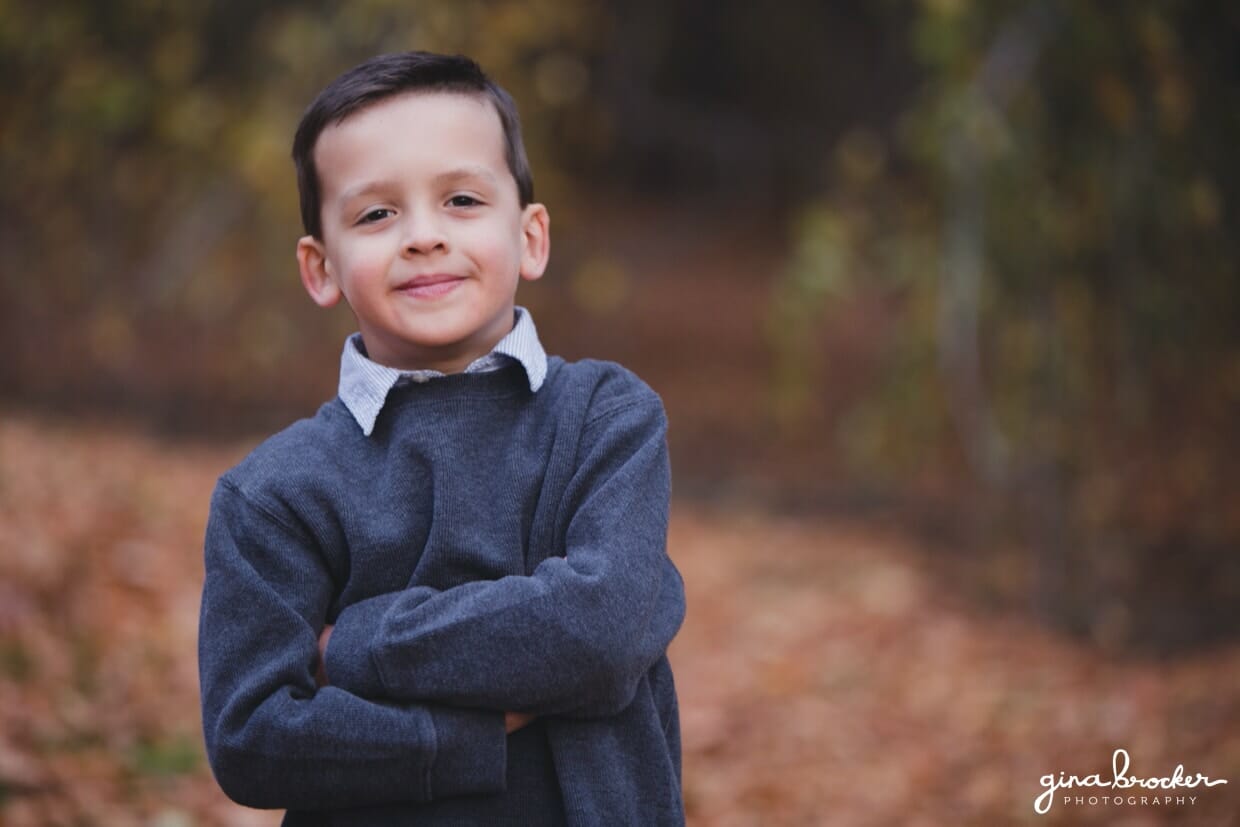 A cute portrait of a boy during a fall family photo session at the Arnold Arboretum in Boston, Massachusetts