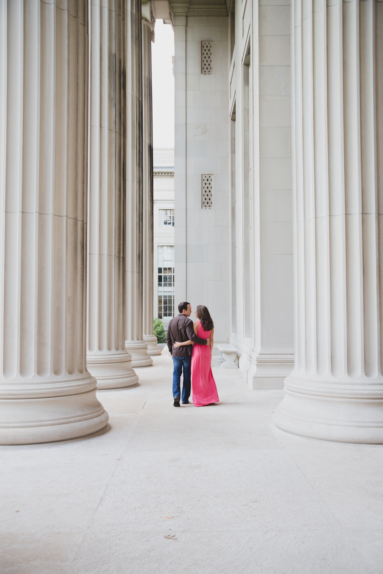A beautiful photograph of a couple walking together at the Massachusetts Institute of Technology during their couple session