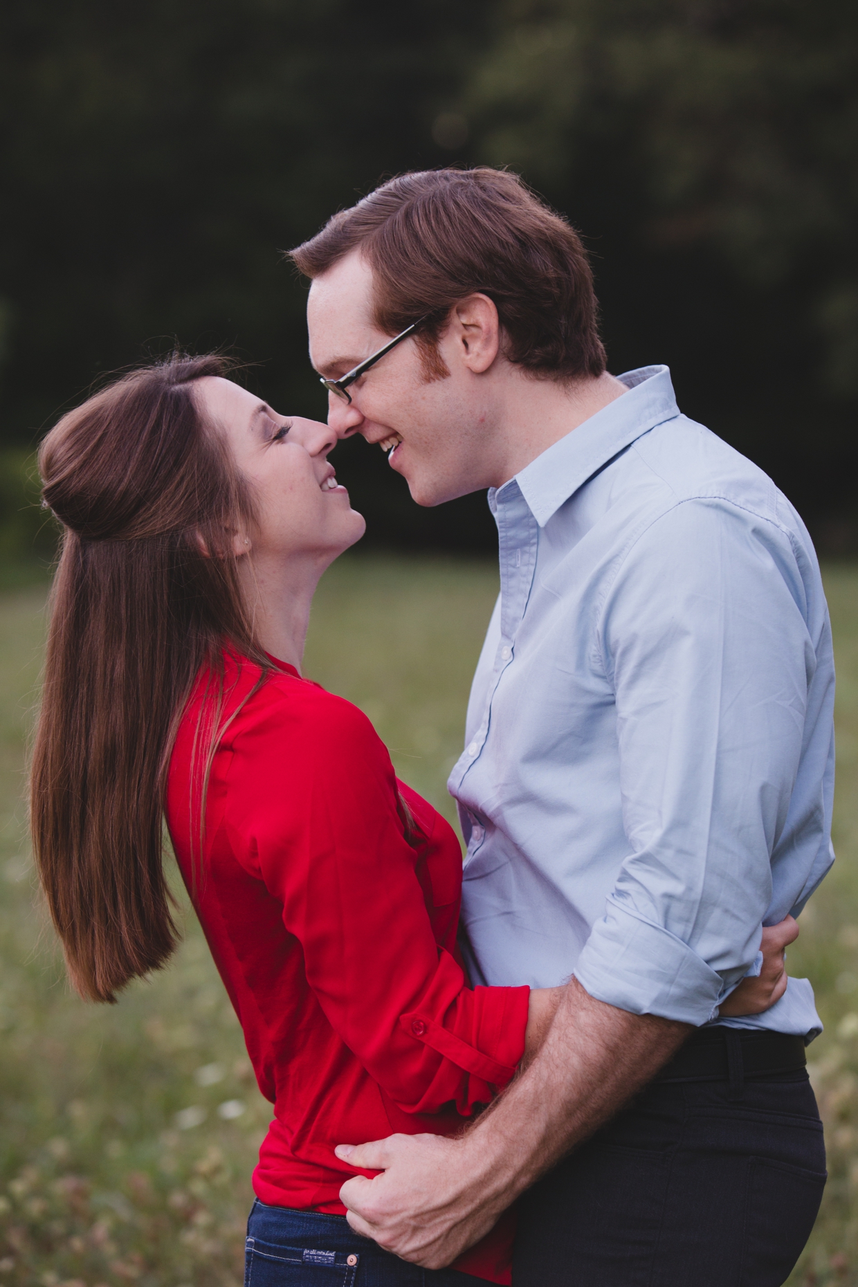 A sweet portrait of a couple rubbing noses during their engagement session at Boston's Arnold Arboretum