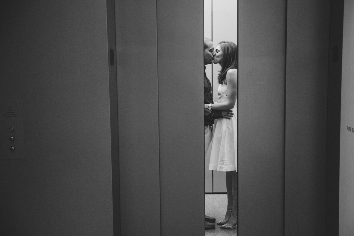 A creative photograph of a couple kissing in the elevator during their engagement session the Museum of Fine Arts in Boston