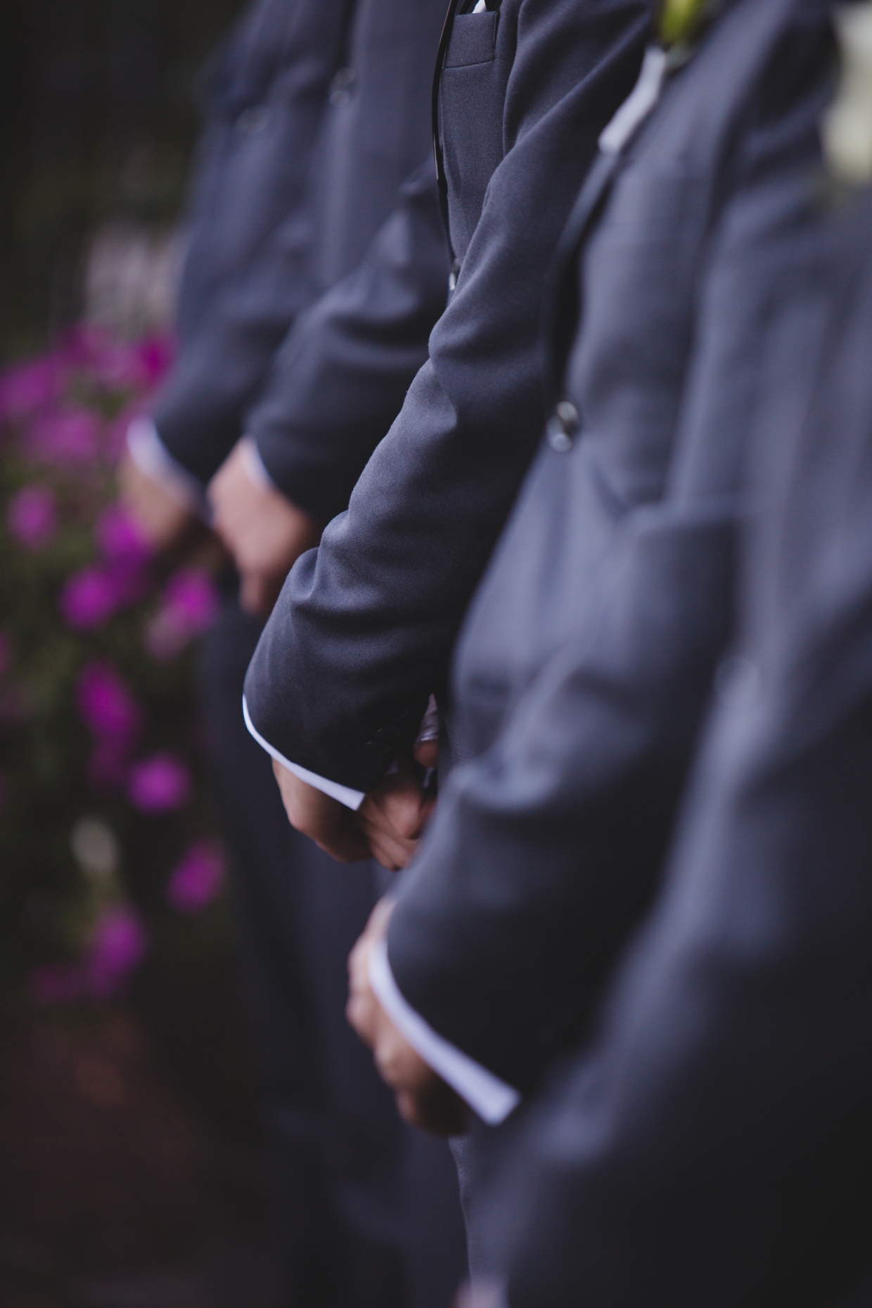 A detailed photograph of the groomsmen before the start of a wedding ceremony at the Boston Marriott Hotel