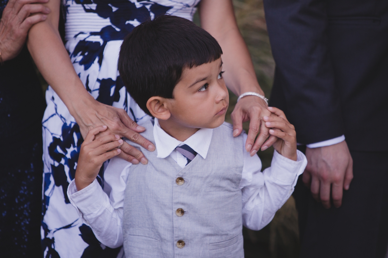 A sweet photograph of a ring bearer during a wedding ceremony at the Boston Marriott Hotel