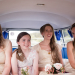 Documentary style photograph of bridesmaids laughing on the way to the wedding ceremony