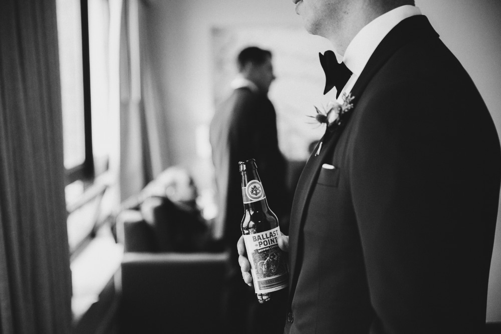 A documentary photograph of groom at the Hyatt Regency Hotel before his wedding in Newport, Rhode Island