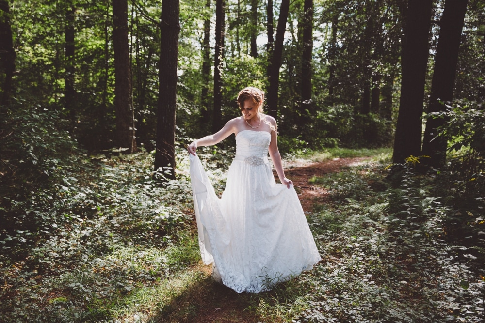 An artistic portrait of a bride in the woods during her rustic River Club Wedding in Scituate, Massachusetts 