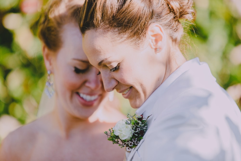 A emotional and artistic portrait of two brides during their rustic barn wedding at Kitz Farm in New Hampshire