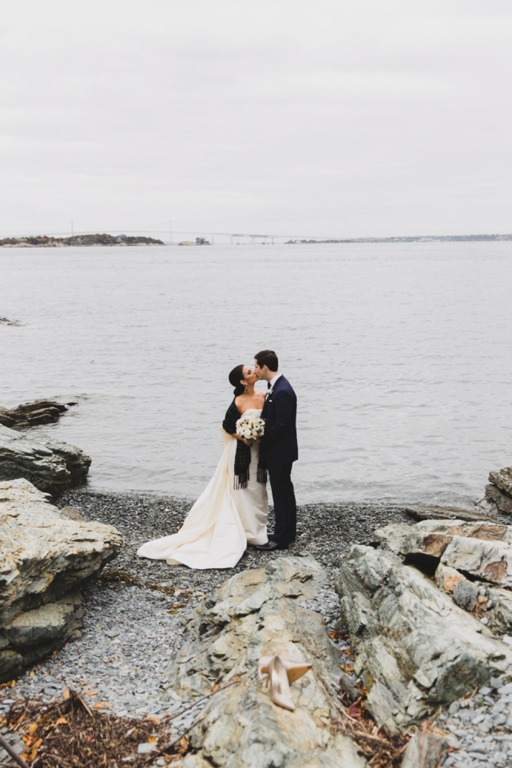 A portrait of a bride and groom by the sea during their wedding at the Castle Hill Inn in Newport, Rhode Island