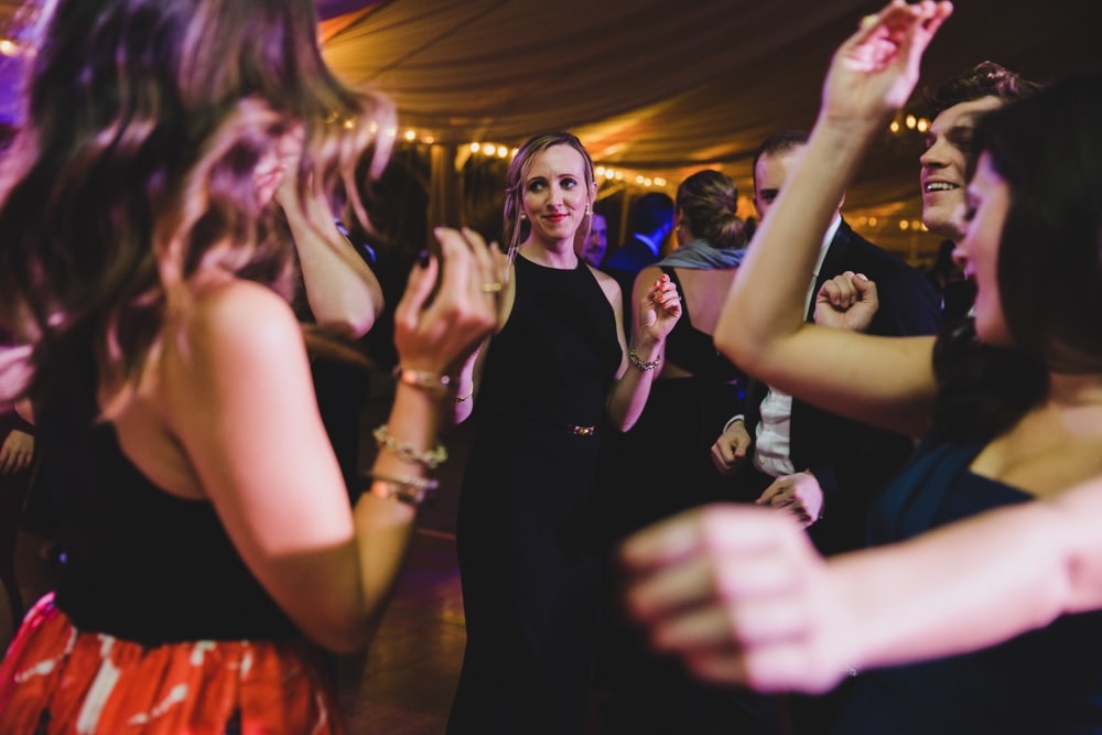A documentary photograph of ladies dancing at a Castle Hill Inn Wedding in Newport, Rhode Island