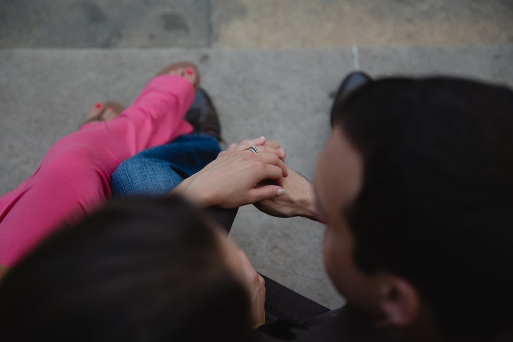 An artistic and photojournalistic photograph of a couple holding hands during their engagement session at the Massachusetts Institute of Technology