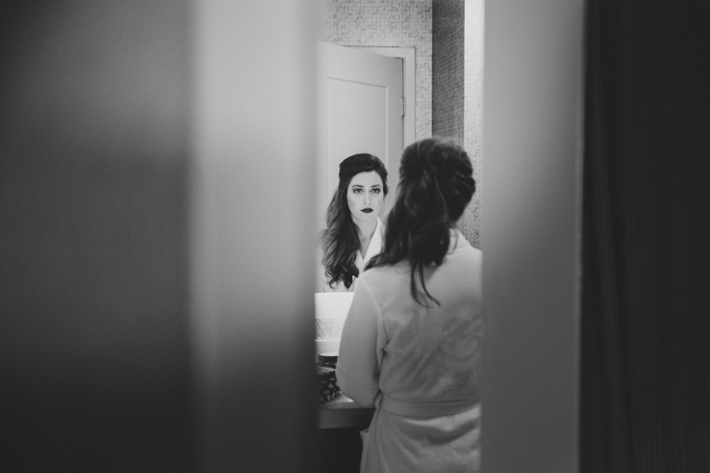 A photojournalistic photograph of a bride getting ready for her wedding at the Oceanview of Nahant in Massachusetts