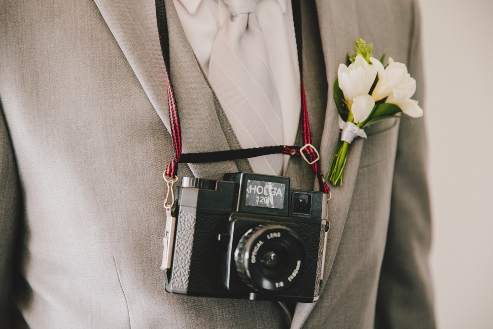 A detailed photograph of a groomsmen's Holga camera at a fun, cape cod wedding at Pilgrim's Monument in Provincetown, Massachusetts