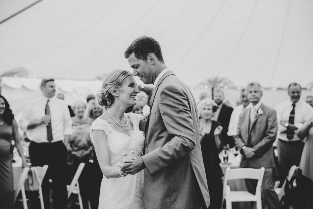 A bride and groom share their first dance during a fun summertime Cape Cod wedding at Pilgrim's Monument in Provincetown, Massachusetts